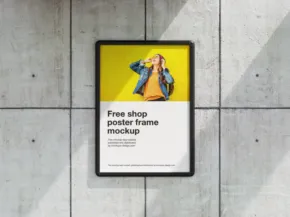 A framed poster on a concrete wall displaying a template mockup with vibrant yellow background and text. - PSD Mockup
