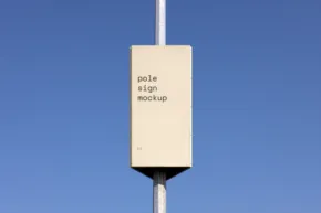 A solar panel attached to a white pole against a clear blue sky, with the template "solar stop north-up" written on it. - PSD Mockup