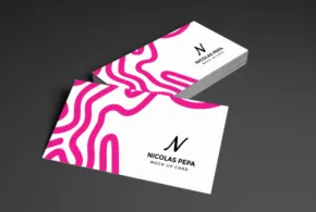 A business card template with a pink and white design. - PSD Mockup
