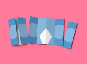Five blue cards arranged in a fan shape with a white diamond symbol on the central card against a pink background, serving as an ideal template. - PSD Mockup