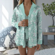 A woman wearing a green and white pajama set is a template for creating a mockup. - PSD Mockup