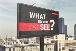 Billboard template featuring "what do you see?" text and an infinity symbol, against a backdrop of a city skyline under a clear sky. - PSD Mockup