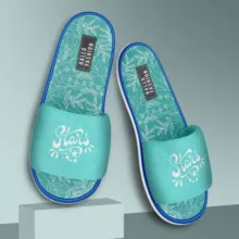 A pair of blue slippers with a mockup floral design on them. - PSD Mockup