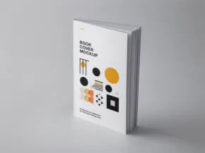 A book with a geometric cover design standing upright against a grey background, serving as an ideal mockup. - PSD Mockup