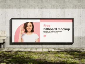 Billboard mockup with an advertisement featuring a smiling woman, mounted on a gray concrete wall, with grass at the base. - PSD Mockup