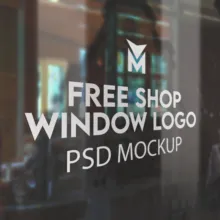 Glass window showcasing the text "Free Shop Window Logo Template Mockup" with a store interior visible in the background. - PSD Mockup