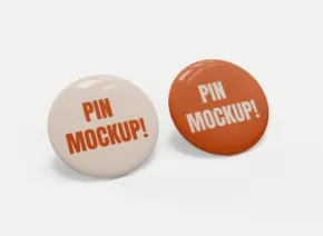 Two round pin mockup badges with text, one ivory and one orange, on a white background. - PSD Mockup