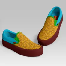 A pair of casual slip-on shoes with a yellow fabric upper and maroon soles, featuring green and blue accents, available as a template. - PSD Mockup