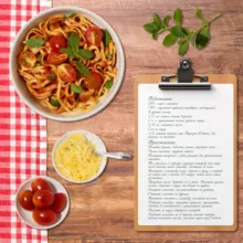 A mockup template of a clipboard with a recipe for spaghetti on it. - PSD Mockup