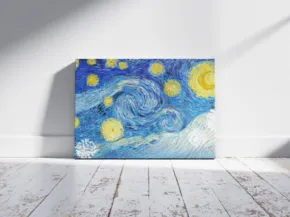 A canvas mockup of "starry night" leaning against a white wall in a room with sunlight casting shadows on a wooden floor. - PSD Mockup