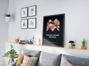 Modern living room interior with a gray sofa, hanging plants, and framed botanical prints on a white wall. A template for the shelf above the sofa displays decorative items. - PSD Mockup