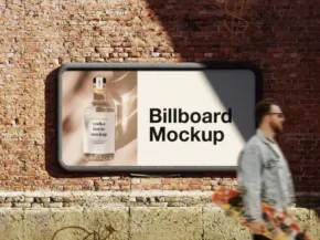 A man walks past a billboard template on a brick wall displaying an advertisement for a cologne bottle. - PSD Mockup