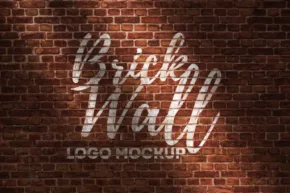 Logo template with the words 'brick wall' in white cursive lettering projected onto a textured brick background. - PSD Mockup