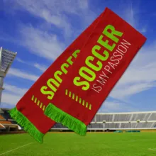 A red soccer scarf with the text "soccer is my passion" floats above a soccer field under a clear blue sky as part of a mockup template. - PSD Mockup