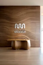 Elegant office lobby with a wooden curved bench and a backlit company logo on a textured wooden wall featuring a mockup template. - PSD Mockup
