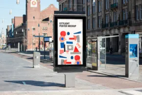 Advertisement mockup displayed on a street-side billboard with an abstract blue and red design on a white background, set against a backdrop of city buildings. - PSD Mockup