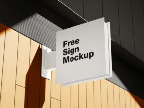 A square sign template hanging from a dark ceiling, displaying the text "free sign mockup" against a backdrop of wooden panels. - PSD Mockup