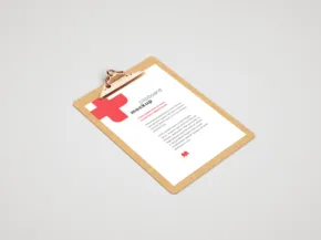 Clipboard with a medical document template attached, viewed from above on a plain light background. - PSD Mockup