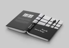 Open mockup booklet with a sudoku grid on one page and a QR code on the other, lying flat on a gray surface. - PSD Mockup