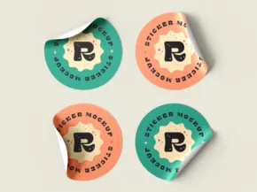 Four round stickers with a vintage design, featuring the letter "r" and the words "ranger natural" on a colored, scalloped badge template. - PSD Mockup
