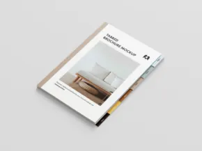 A mockup of a magazine featuring a minimalist living room on the cover, placed on a grey surface with the text "modern interiors. - PSD Mockup