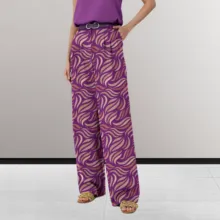 A person wearing patterned purple trousers and a purple top paired with platform sandals, serving as a template. - PSD Mockup