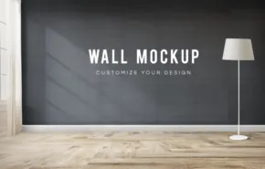 An interior room featuring a wall with "wall template - customizable design" written on it, a wooden floor, and a white floor lamp on the right. - PSD Mockup