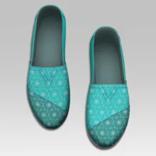 A pair of turquoise-patterned women's loafers displayed on a light gray mockup. - PSD Mockup