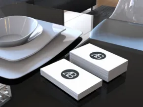 A mockup template of a business card on a table is displayed. - PSD Mockup