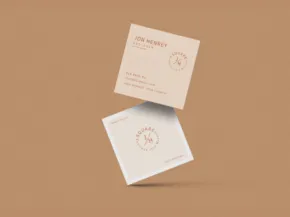 Business cards with a minimalistic design template on a beige background. - PSD Mockup