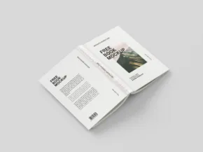 An open magazine template with text and a landscape photograph on a gray background. - PSD Mockup