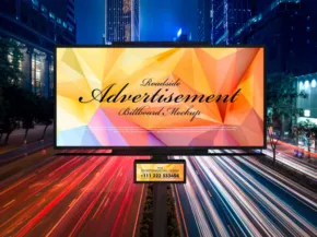 A digital billboard displaying a colorful geometric background with the words "Dynamic Advertisement" above a city street, featuring blurred light trails from moving cars at night. This mockup captures the vibrant energy of urban life. - PSD Mockup