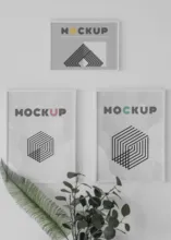 Three framed posters on a wall template. - PSD Mockup