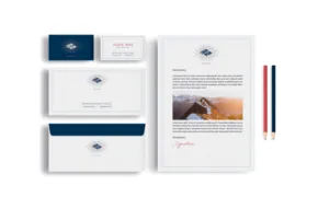 A blue and white stationery set with a mockup of a compass image. - PSD Mockup