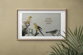 A framed mockup photo of two birds on a wall. - PSD Mockup