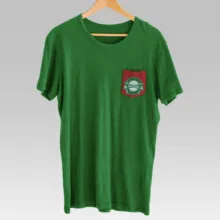 A green t-shirt with a red and green pocket, perfect for creating a mockup or template. - PSD Mockup