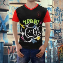 A man wearing a mockup t-shirt with graffiti on it. - PSD Mockup