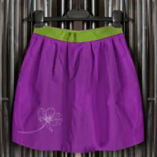 A purple and green skirt with a flower on it, perfect for creating a mockup or template. - PSD Mockup