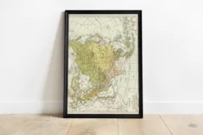 A framed map of the world in a wooden frame mockup. - PSD Mockup