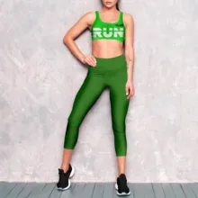 A mockup template of a woman wearing a green sports bra and leggings. - PSD Mockup