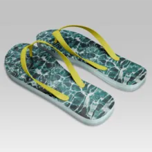 A pair of blue and yellow flip flops with yellow straps in the template. - PSD Mockup