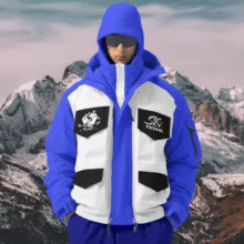 A man wearing a blue and white ski jacket template. - PSD Mockup
