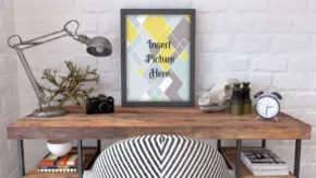 A desk with a lamp and a framed picture available as a mockup. - PSD Mockup