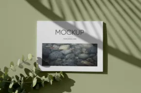 A magazine mockup template on a green wall. - PSD Mockup