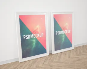 Two framed mockup templates on a wooden floor. - PSD Mockup