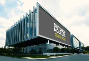 A modern building with a billboard mockup. - PSD Mockup