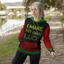 A woman wearing a hoodie that says i make my own luck in the provided template. - PSD Mockup