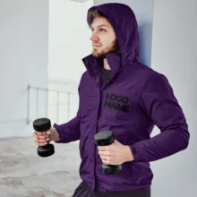 A man wearing a purple hooded jacket with dumbbells mockup. - PSD Mockup