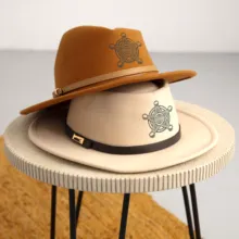 A table displaying a mockup of two cowboy hats. - PSD Mockup