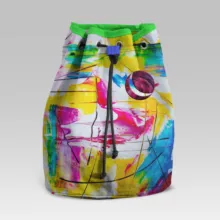A colorful mockup drawstring bag with a colorful painting on it. - PSD Mockup